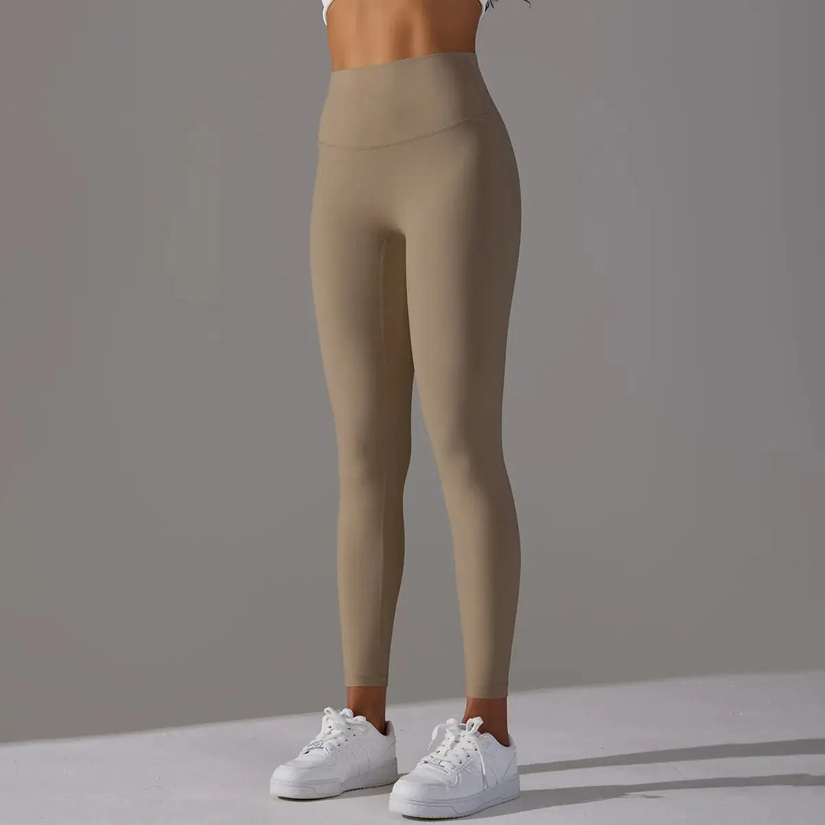 Leggings beige high-waist nude-feel fabric designed for fitness, running, and yoga workouts for gym training sessions.