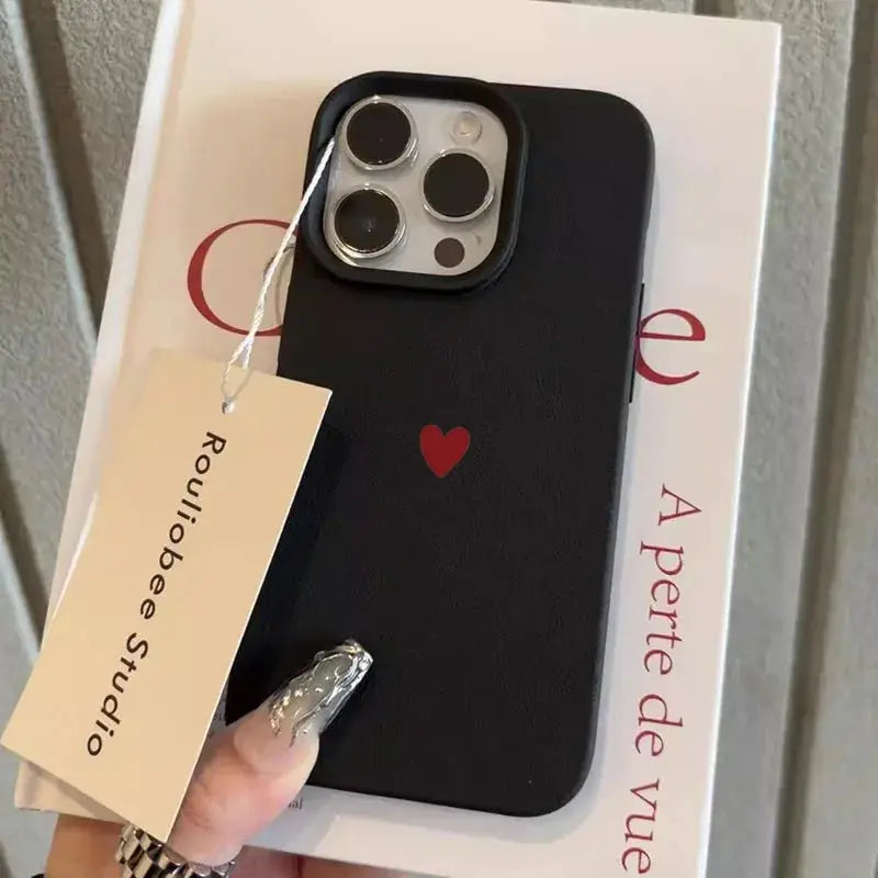 Phone case with red heart design on black soft TPU for iPhone models, by Simples Market