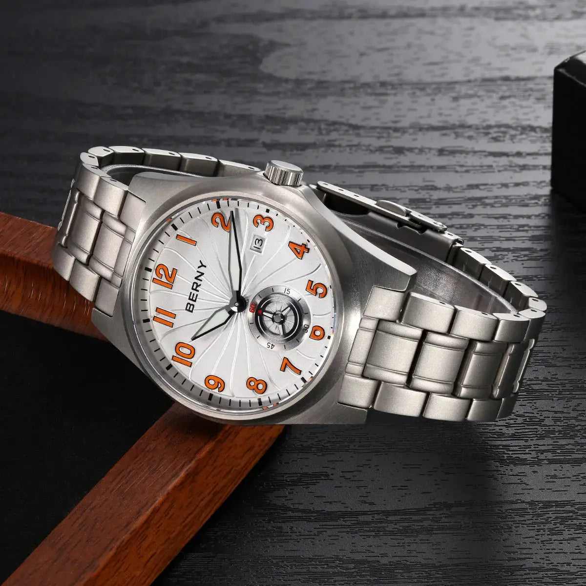 BERNY titanium automatic men's watch with orange numerals on white dial and metal bracelet, date window at 3 o'clock