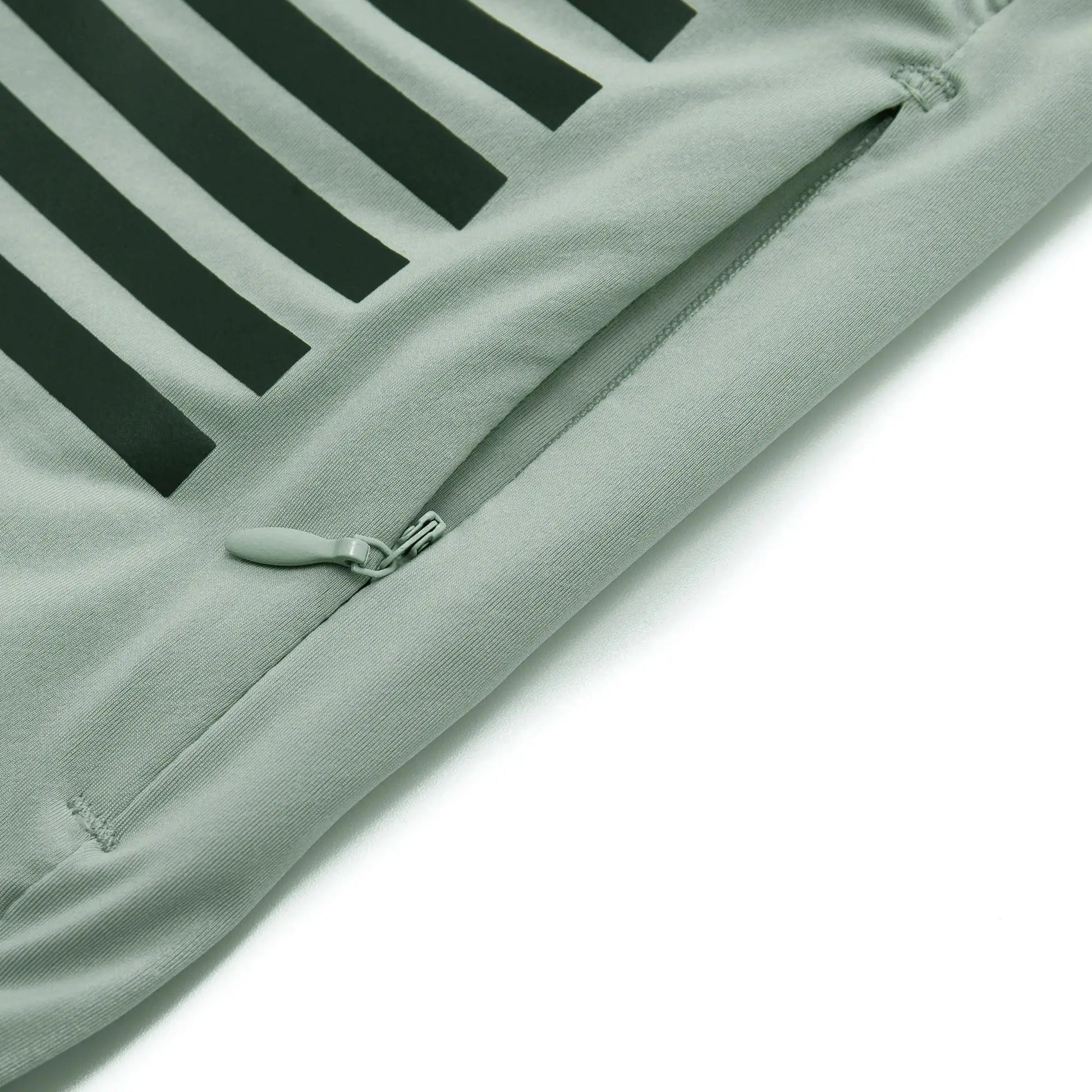 YKYWBIKE men's cycling jersey close-up of light green fabric with zipper and bold black stripe design.