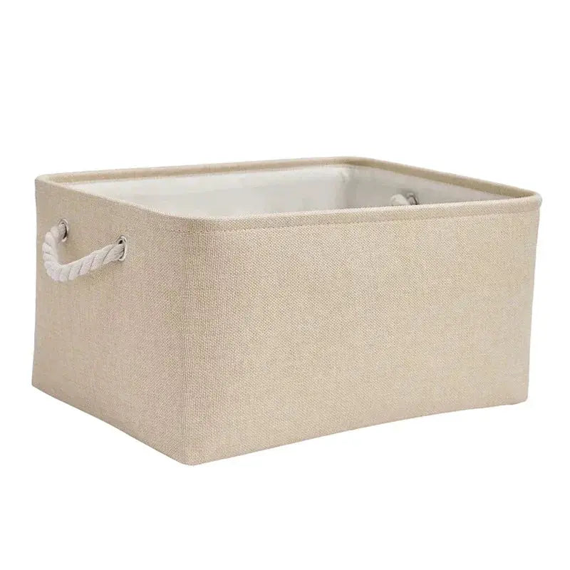 Folding linen fabric storage basket by Simples Market with rope handles and white lining, beige exterior