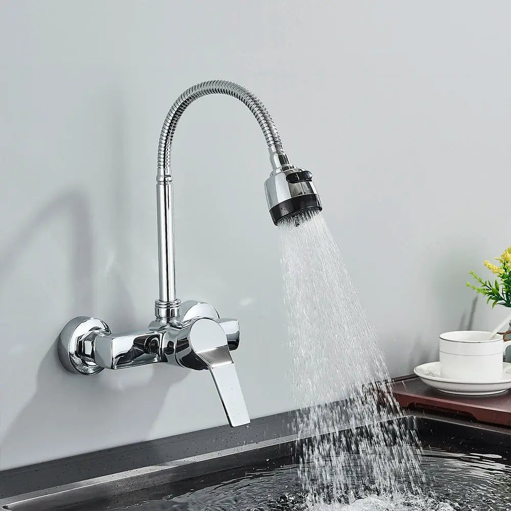 Chrome wall-mounted kitchen faucet with a flexible pull-down spray head and coiled spring hose