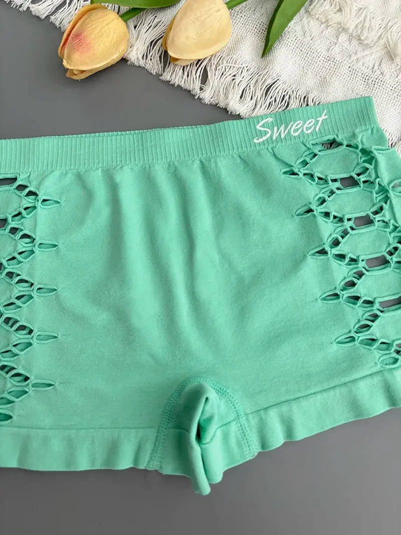 Mint green seamless sports underpants with side lattice cutouts and Sweet waistband branding.