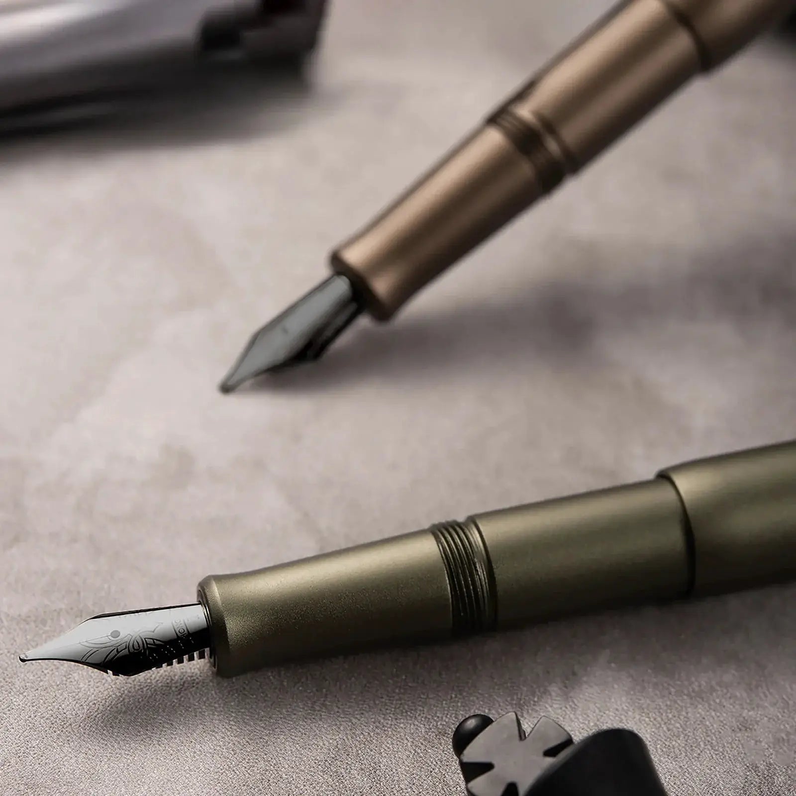 Two Hongdian M2 fountain pens with bronze bodies and metal nibs, Black Forest Metaverse design, Simples Market