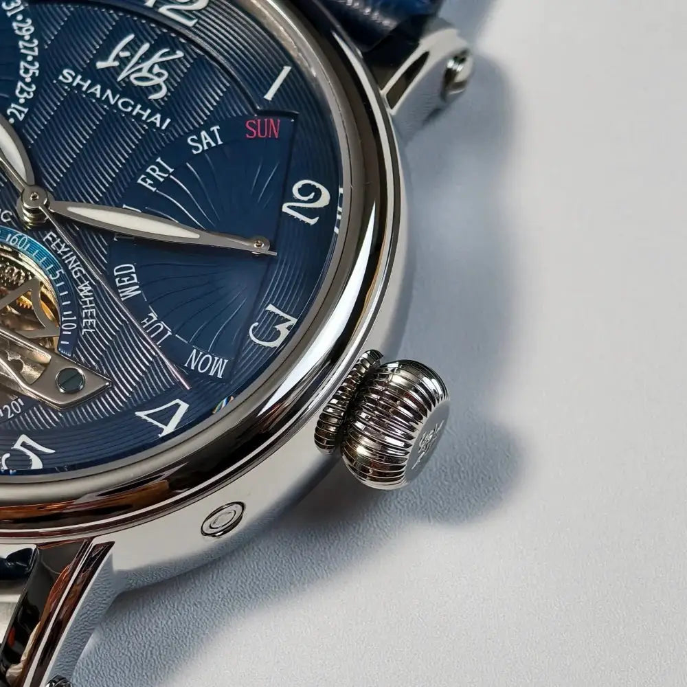 Shanghai automatic wristwatch with blue dial, stainless steel case, leather strap and calendar function