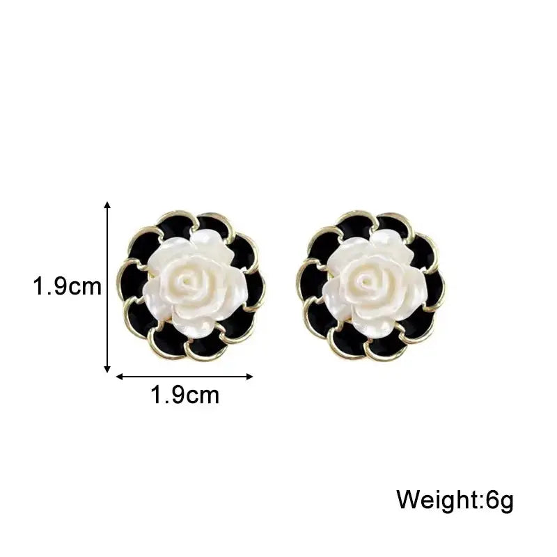 Simples Market flower enamel earrings, white rose center with black petal backdrop and gold trim, pair