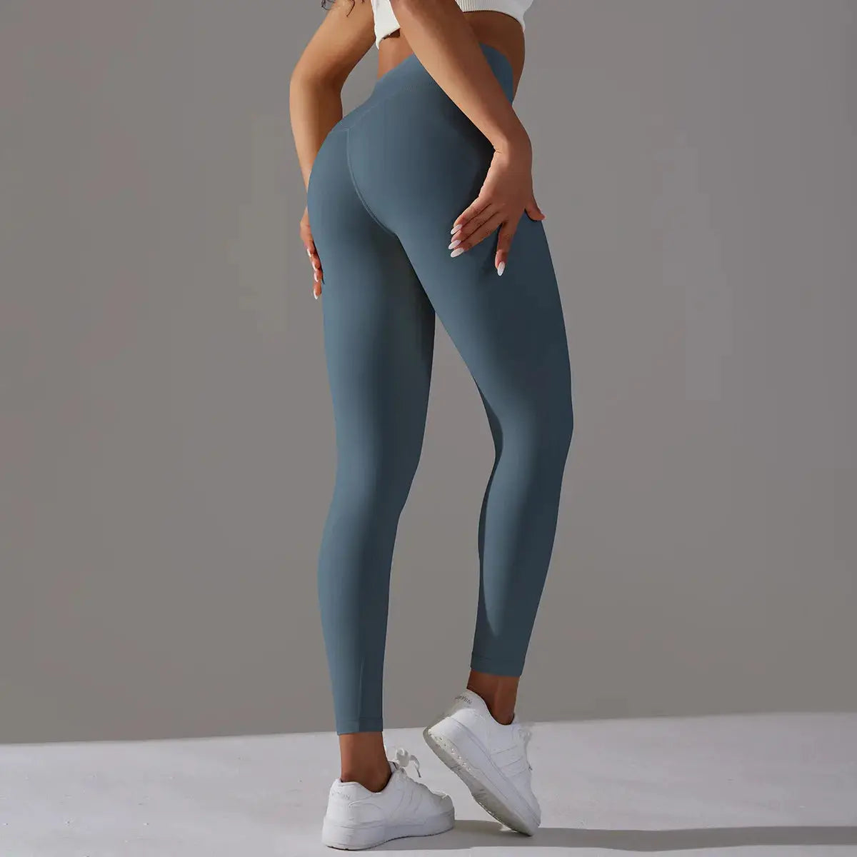 Women's high-waist teal leggings by Simples Market for gym, running, yoga.