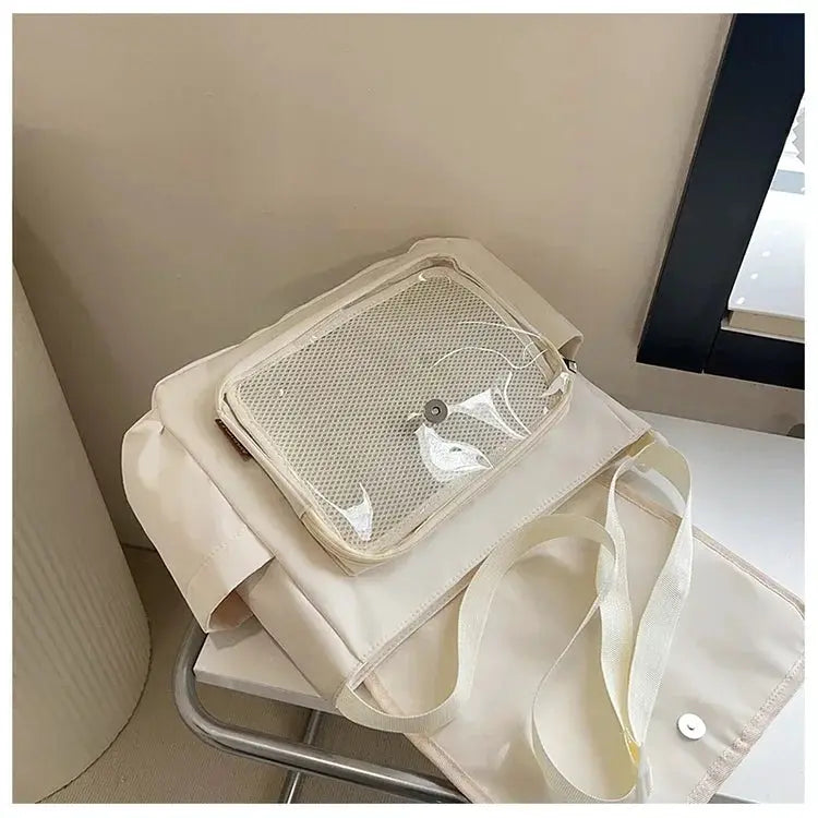 Beige itabag shoulder bag with clear front pocket and adjustable strap