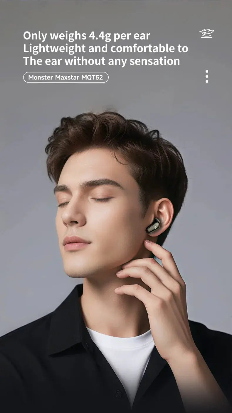 Monster MQT52 wireless earbuds, black compact in-ear design worn by a person.