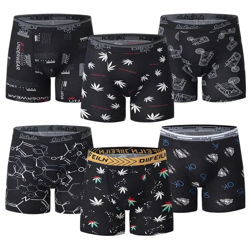 Six-pack of Simples Market men's boxer briefs in breathable stretch fabric with assorted black prints.