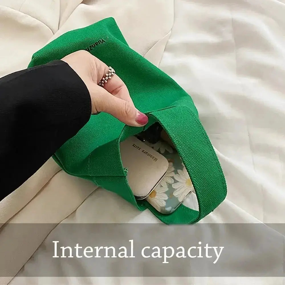 Green canvas shoulder crossbody bag by Simples Market with large internal capacity
