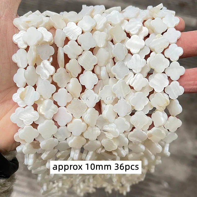 Natural shell beads, irregular flower-shaped, white mother-of-pearl, approx 10mm, 36pcs