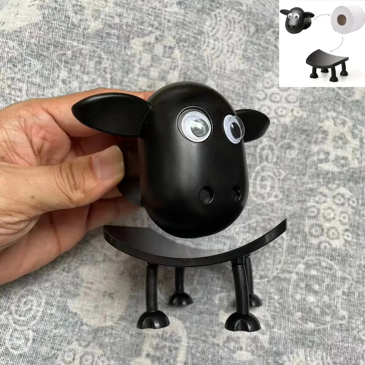 Toilet paper holder featuring a black animal figurine for bathroom decor by Simples Market