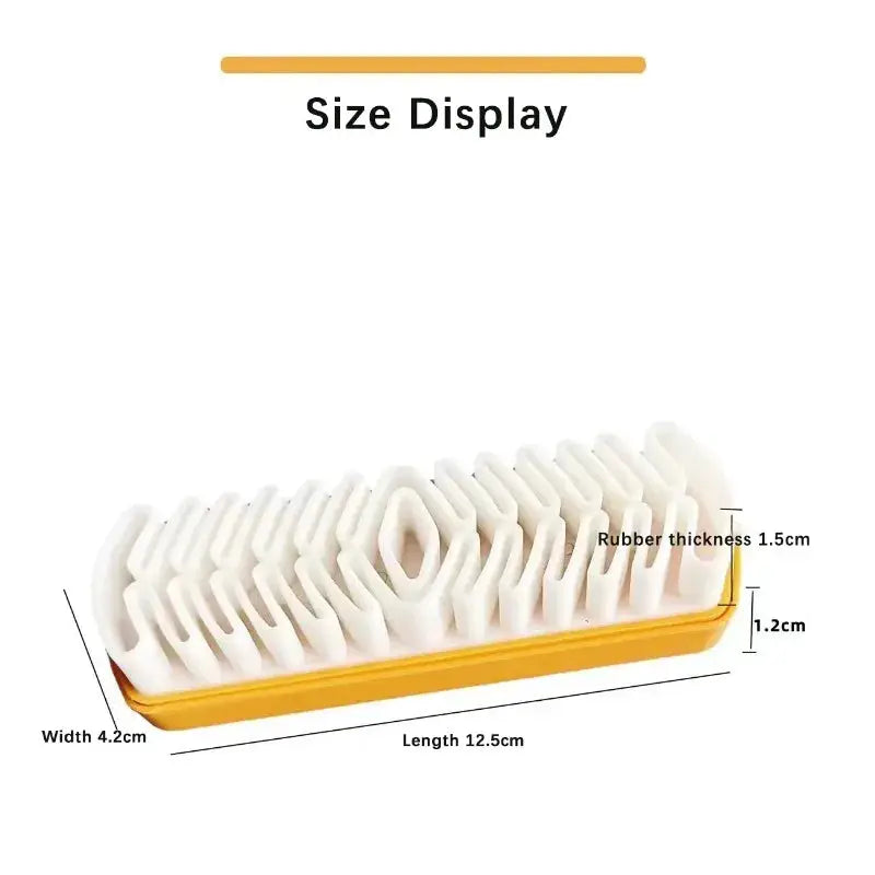 Suede cleaning brush by Simples Market; white bristles, yellow base, 12.5 cm long.