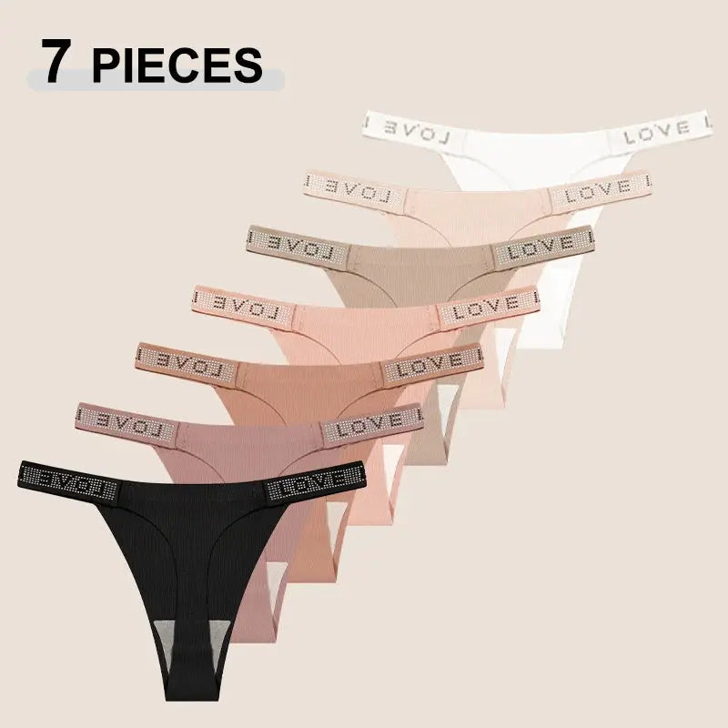 7-piece set of women's low-rise thongs in assorted colors with rhinestone waistband reading LOVE