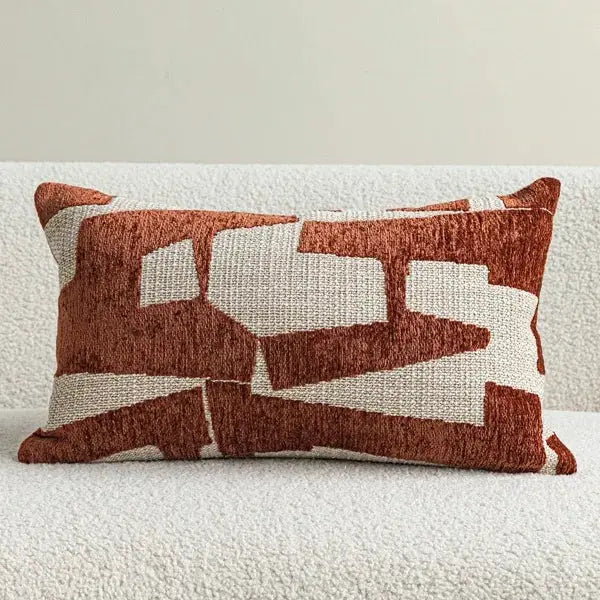 Pillow cover in ivory and rust red with an abstract block pattern on textured woven fabric, ideal decorative cushion for sofa