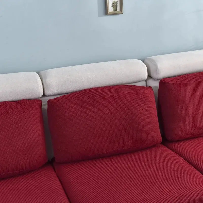 Elastic sofa cover in red for living room; thick textured fabric, removable couch slipcover.
