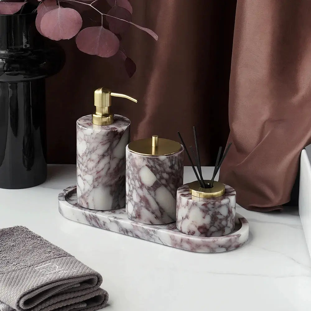 Calacatta Viola marble bathroom set with soap dispenser, cotton swabs jar, and diffuser on oval tray with gold accents