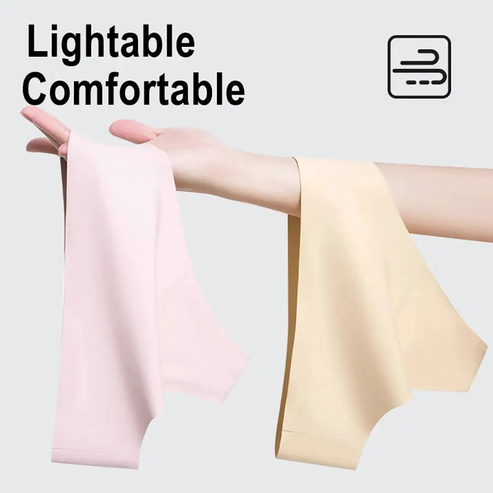 Anti-cameltoe seamless panties fabric swatches in pink and beige held by hand