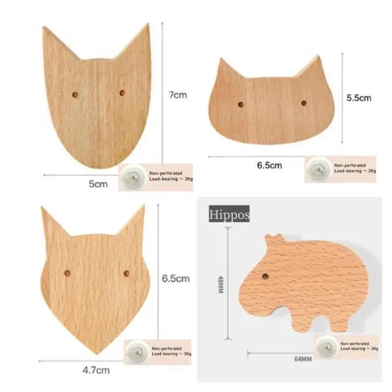 Set of 4 wooden animal wall hooks in natural wood finish for kids' room by Simples Market