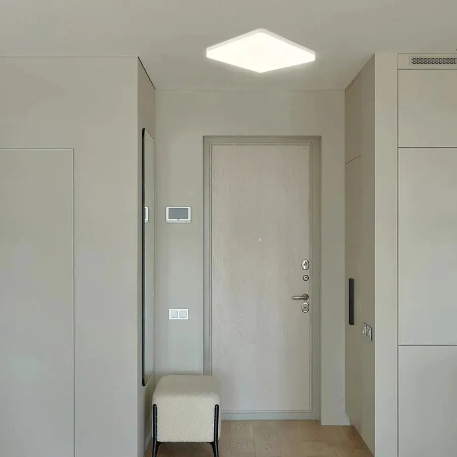 MARPOU square LED ceiling lamp in neutral white light mounted in a modern hallway