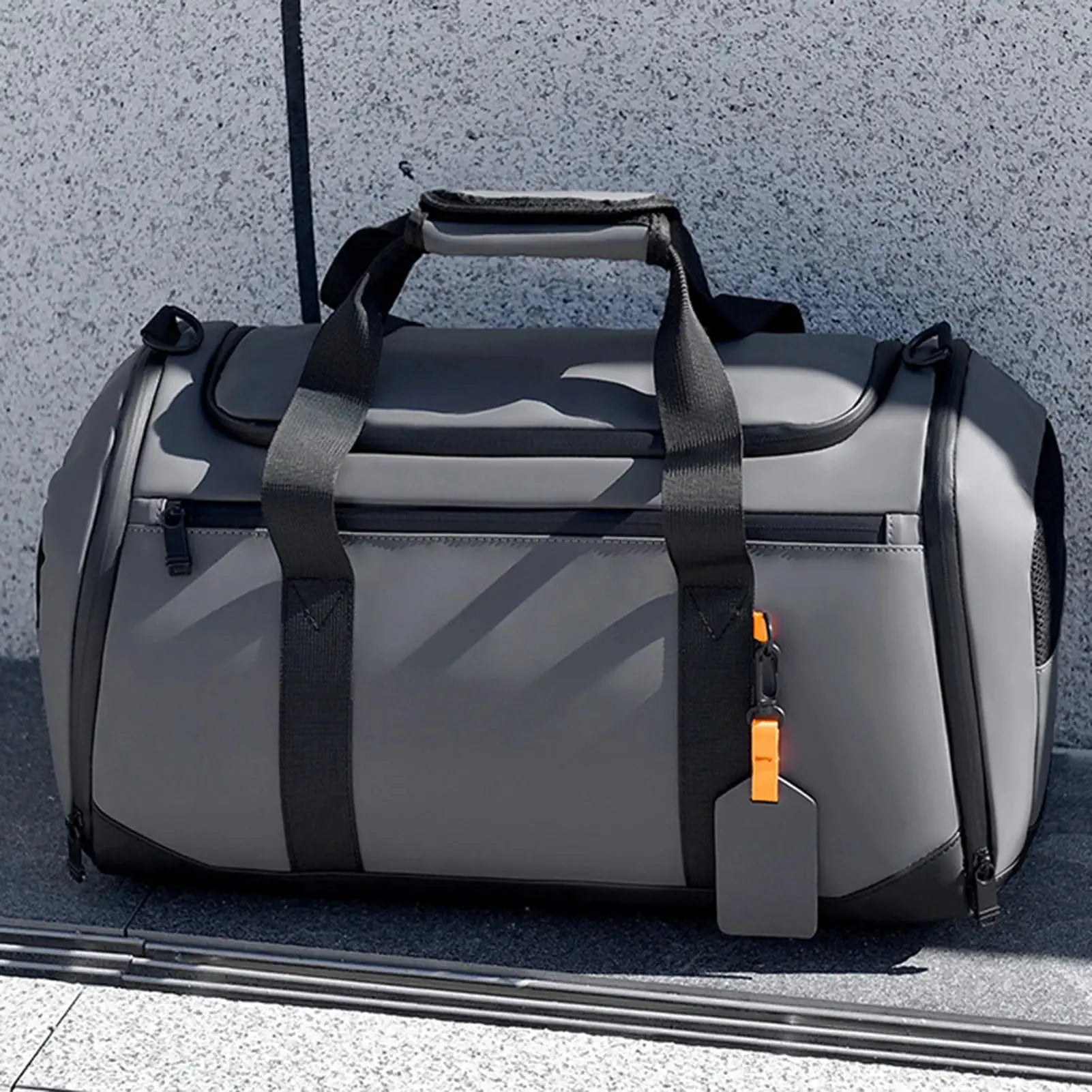 Large capacity travel gym bag by Simples Market in gray with orange zipper pull and multiple pockets