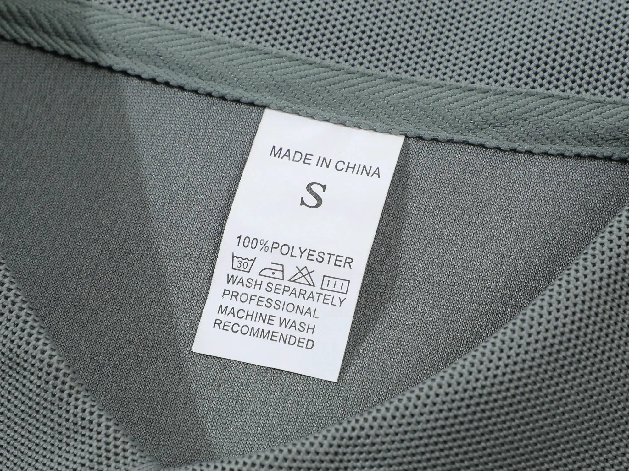 Men's gray polo shirt, 100% polyester, size S; tag reads Made in China.