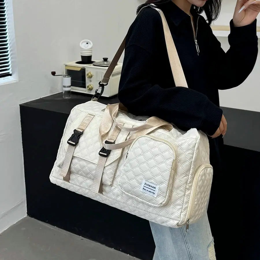 Durable nylon travel duffle bag by Simples Market, quilted cream fabric with beige straps and front zip pocket