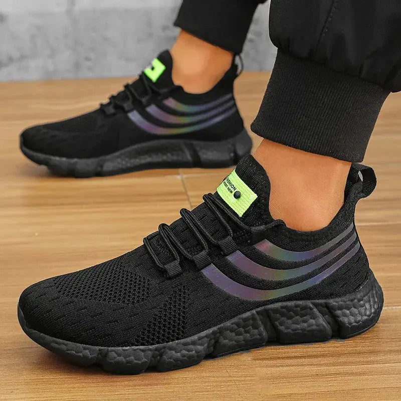 Pair of men's black breathable sneakers with anti-slip sole, iridescent side stripes and neon tongue label