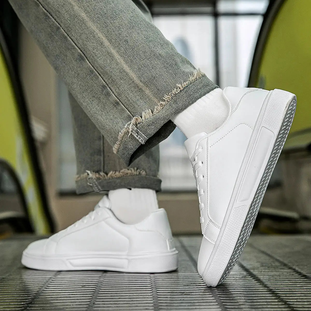 White PU leather casual sneakers with vulcanized soles; two shoes shown