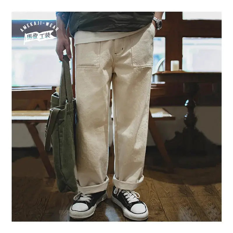 Maden Vintage 11.2oz white cottonseed hull jeans for men; casual loose-fit straight trousers in cream with pockets.
