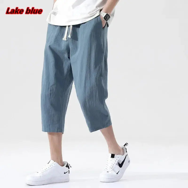 Men's lake-blue linen shorts with drawstring, lightweight straight-leg cropped pants.
