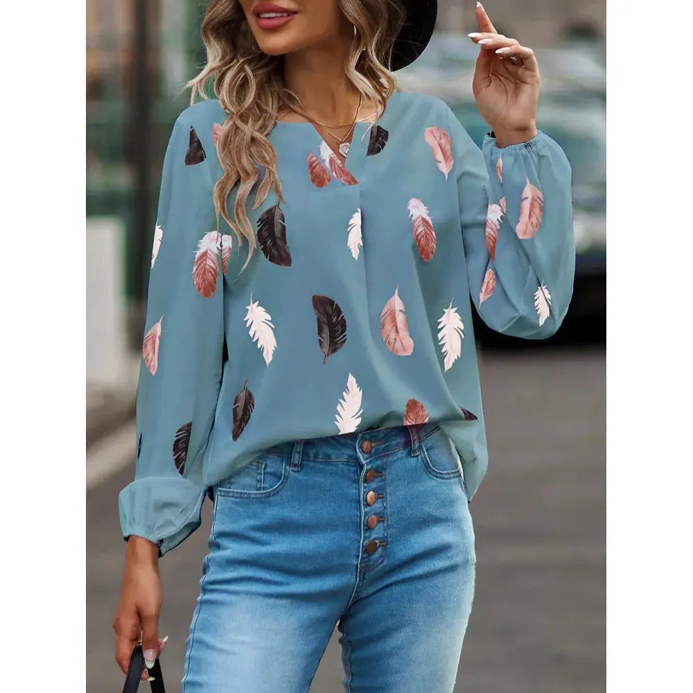 Women's feather-print chiffon blouse in light blue with long sleeves