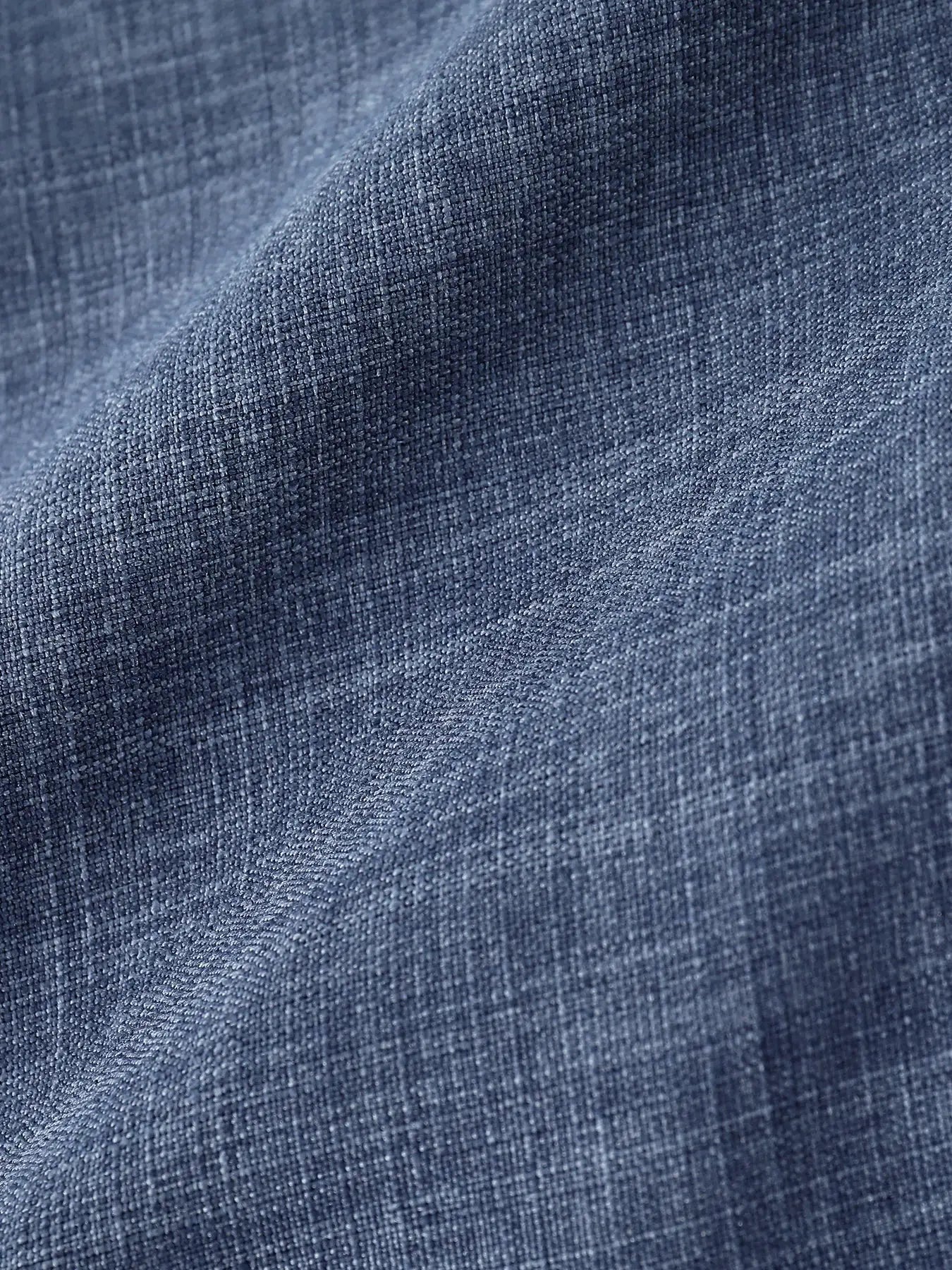 Men's casual linen shirt fabric in blue denim texture; close-up weave detail