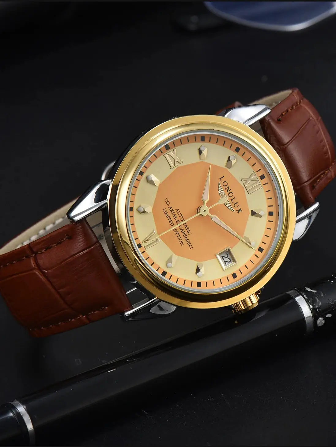 LONGLUX automatic men's wristwatch with brown leather strap, gold-tone case, peach dial, and date window