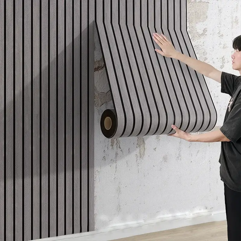 3M New Grille 3D wall panel wallpaper in gray stripes, self-adhesive and thickened, being applied to a wall