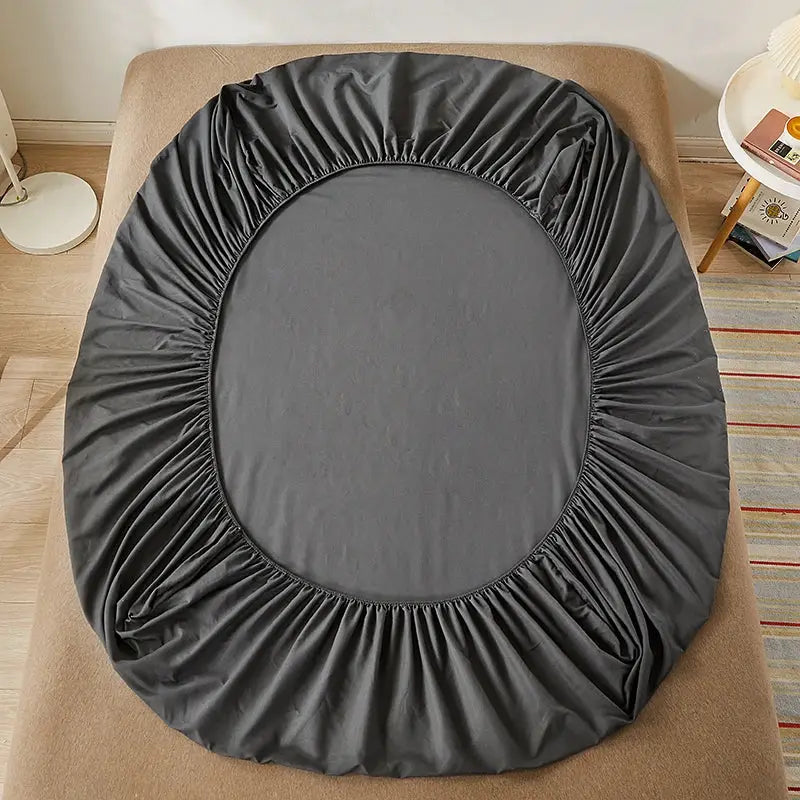 Gray cotton fitted bed sheet with elastic edge; part of a 3-piece bedding set