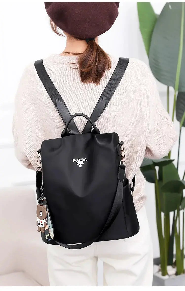 Women’s backpack by Simples Market, black Oxford cloth with top handle and adjustable straps, large capacity
