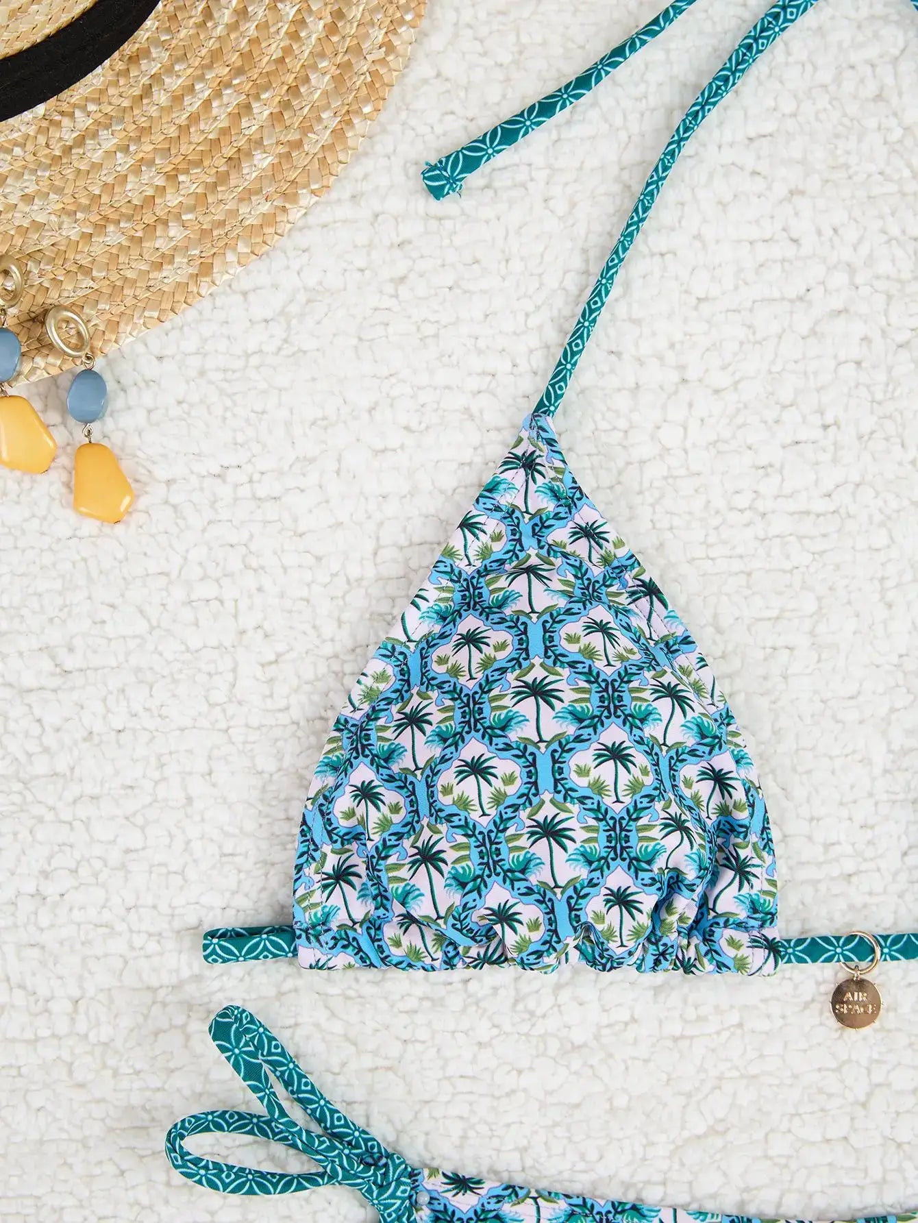 Simples Market triangle bikini set with floral print push-up top and Brazilian-cut bottoms.