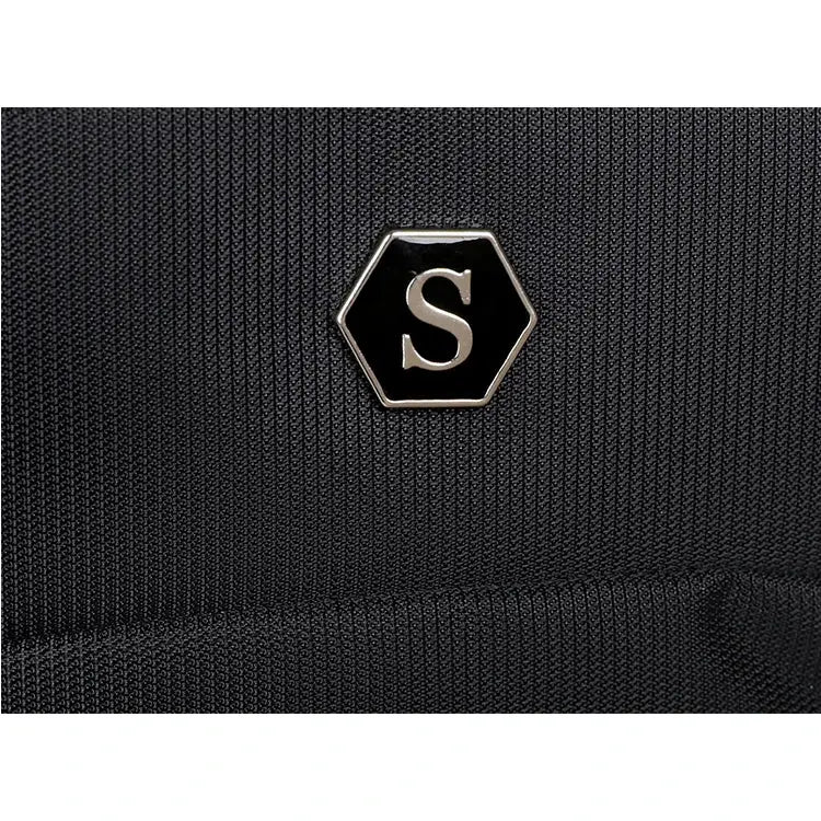 Travel backpack by Simples Market with black fabric and hexagonal S logo badge