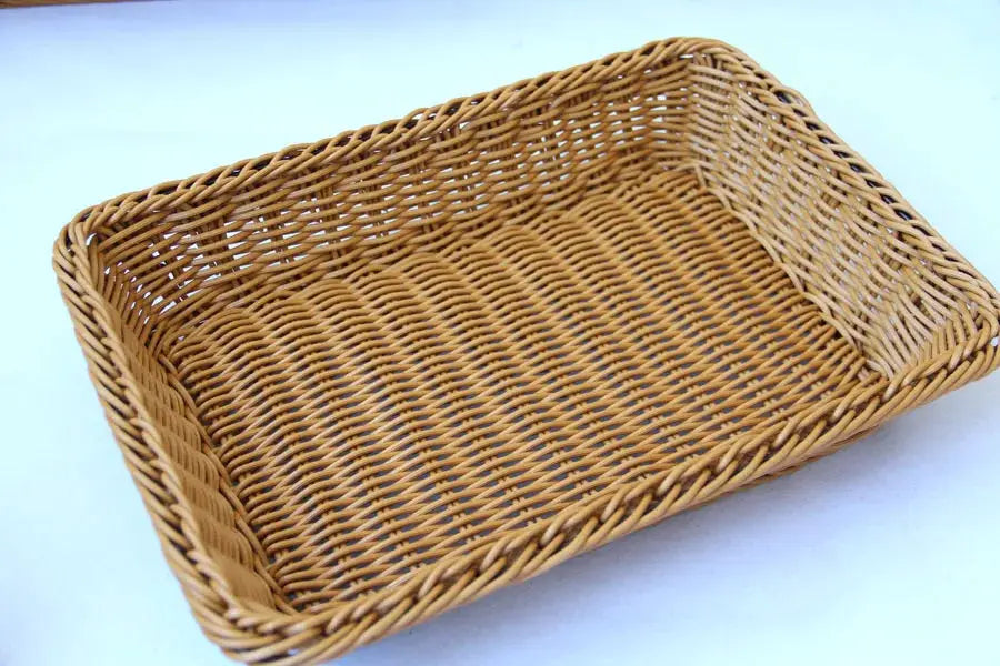 Rectangular hand-woven imitation rattan storage basket for kitchen; light brown wicker.