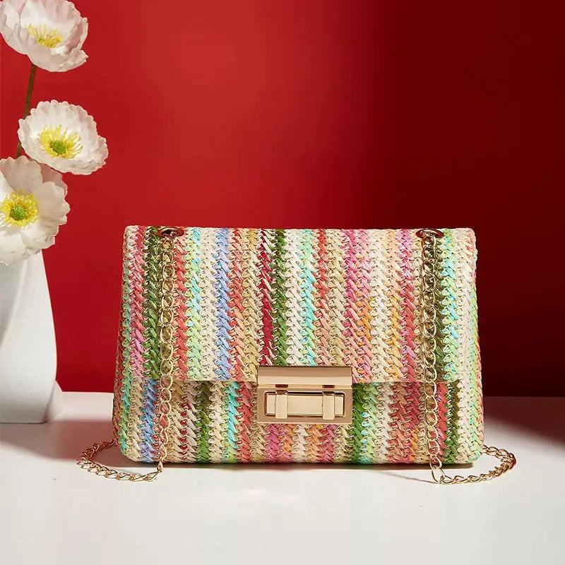 Crossbody bag for women with rainbow woven stripes, gold-tone chain strap and clasp