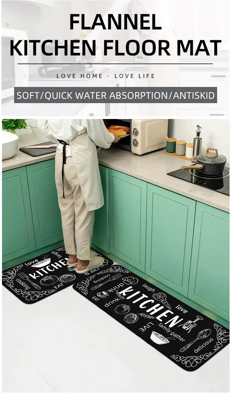 Two black flannel kitchen floor mats with white printed kitchen icons and words, absorbent, non-slip, placed in front of teal cabinets