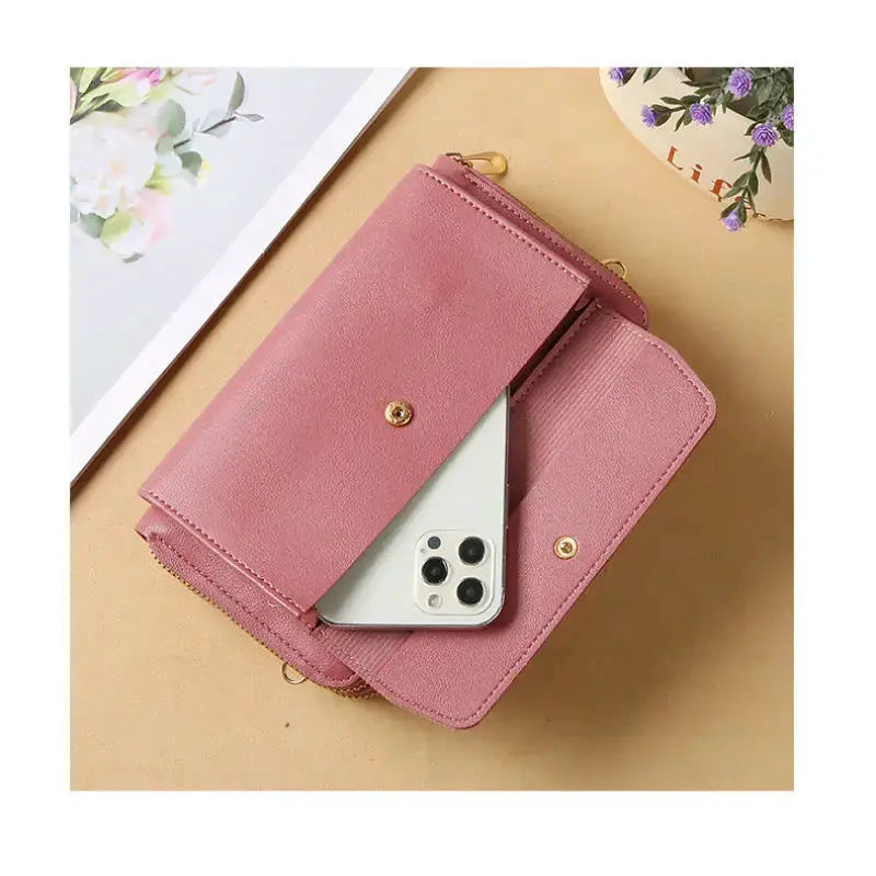 Pink women's crossbody bag with flap and phone pocket, faux leather finish