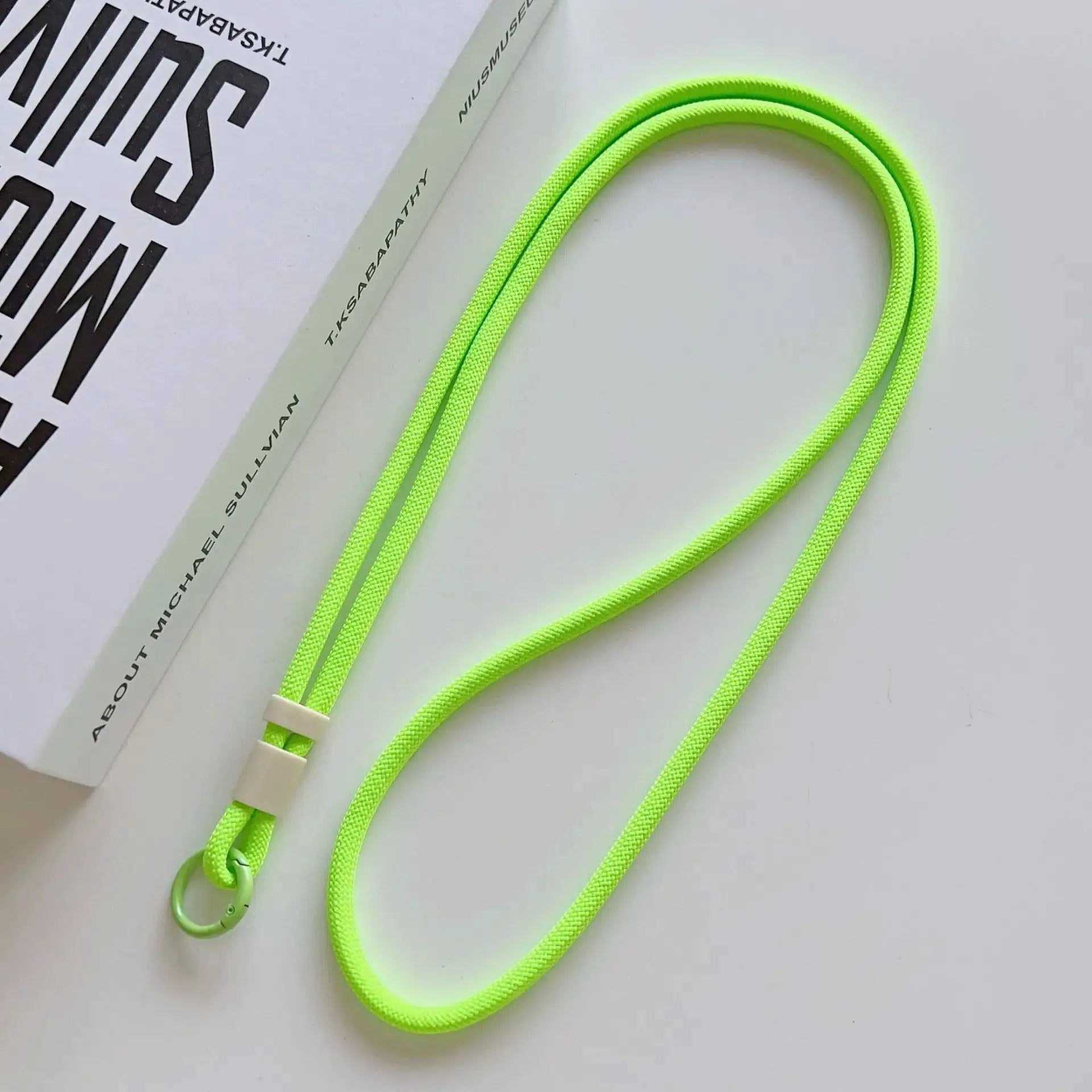 Mobile phone lanyard in neon green, braided rope with metal ring