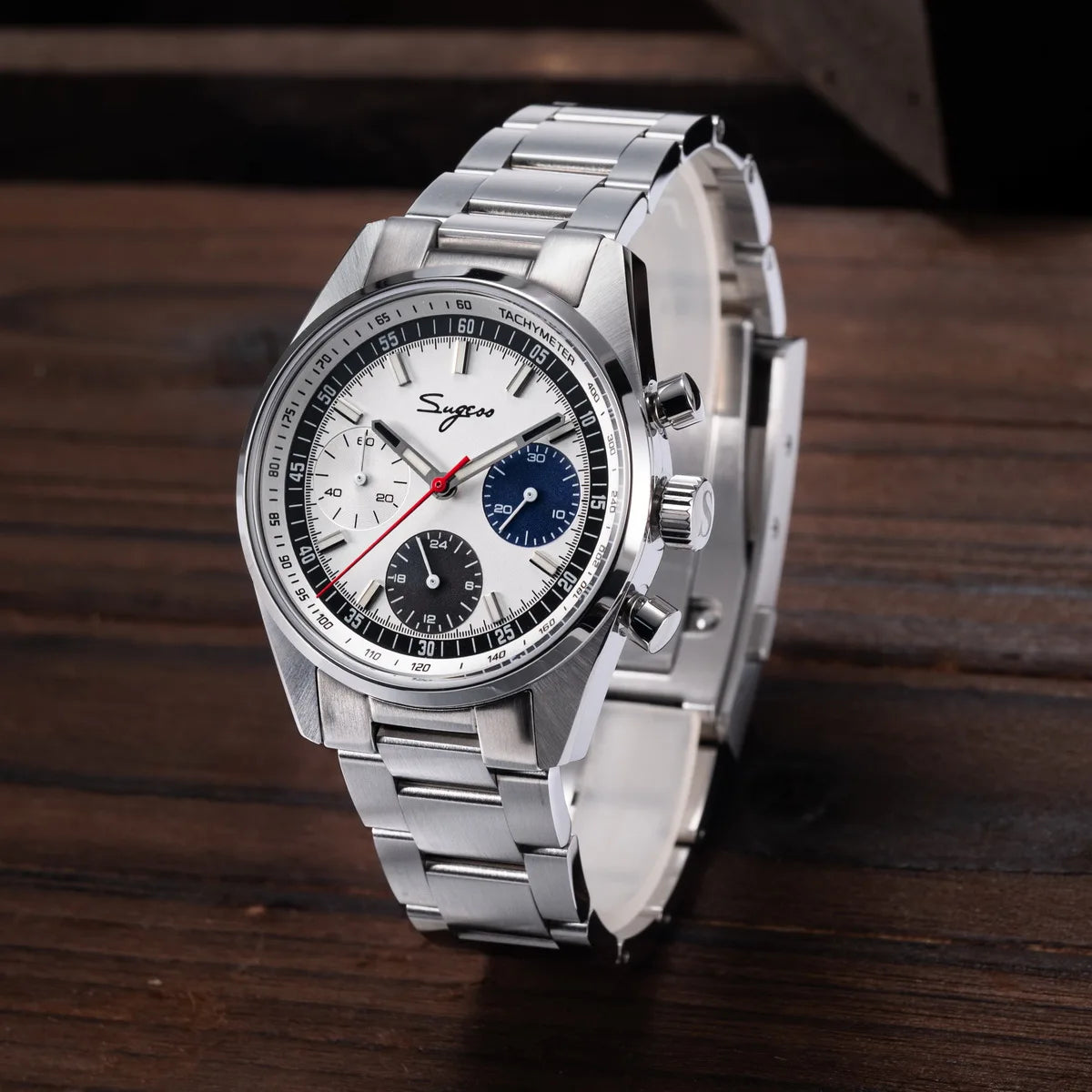 Sugess mens watch, 38mm stainless steel chronograph with white dial, black tachymeter, red seconds hand, blue subdial.