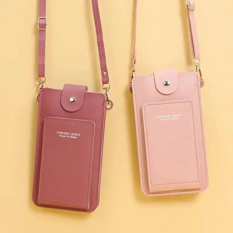 Two pink soft-leather crossbody phone purses with front pockets and snap closures, in mauve and blush pink.