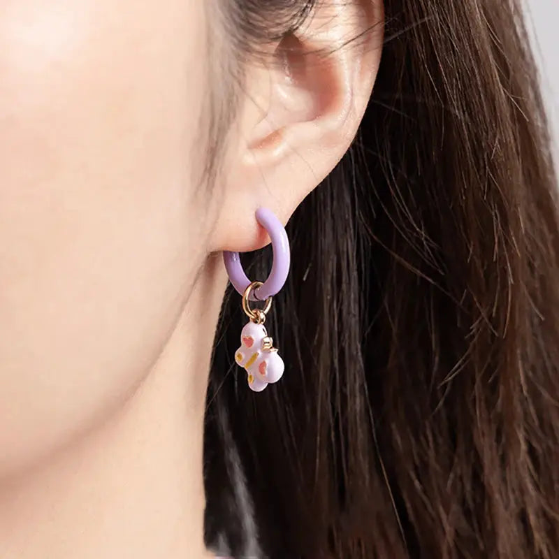 Simples Market single purple hoop earring with a dangling white cartoon animal charm