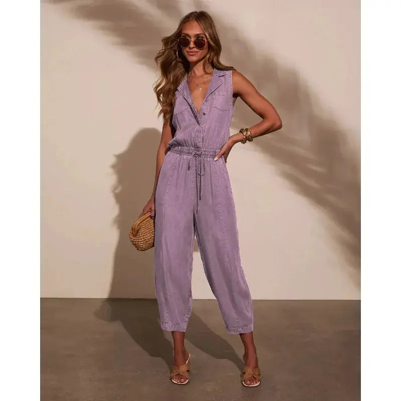 Women’s lavender denim jumpsuit with sleeveless design, drawstring waist, pockets and button front by Simples Market