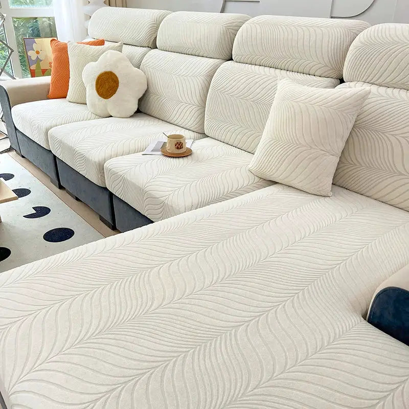 Splash-proof jacquard sofa cover in cream for sectional sofa, high elasticity with anti-dirt protection.